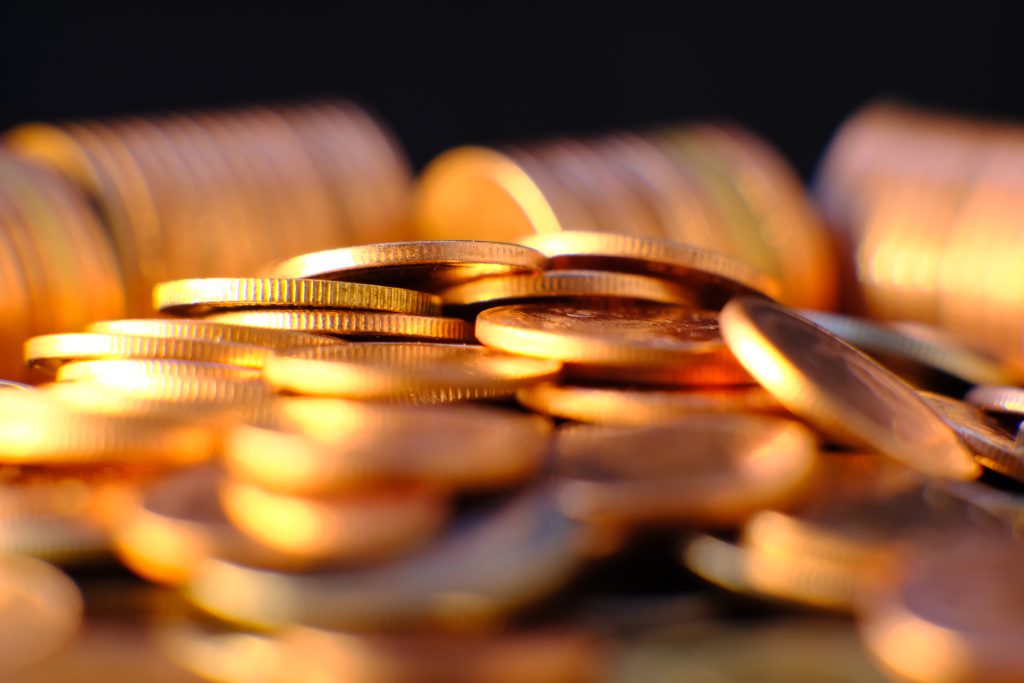 Golden coin on table background and business or finance saving money